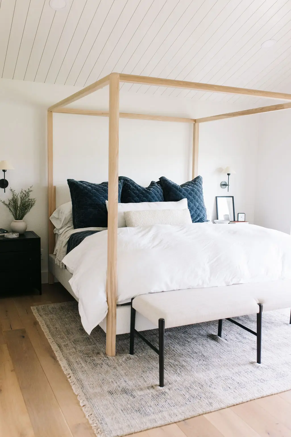 Interior Decorator, large bed with wooden railing around and above it