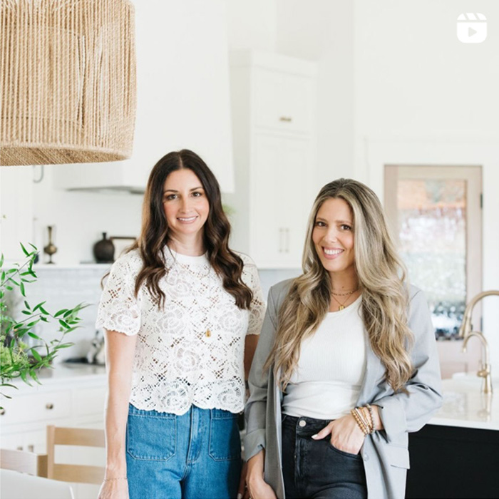 Interior Designers, Allann and Victoria posing in a finished design space